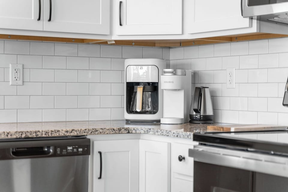 Fuel your mornings with a brew-your-way coffee bar featuring both a Keurig and a traditional coffee pot.