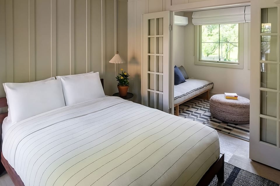 Wake up slowly with morning light and a cozy lounge nook.