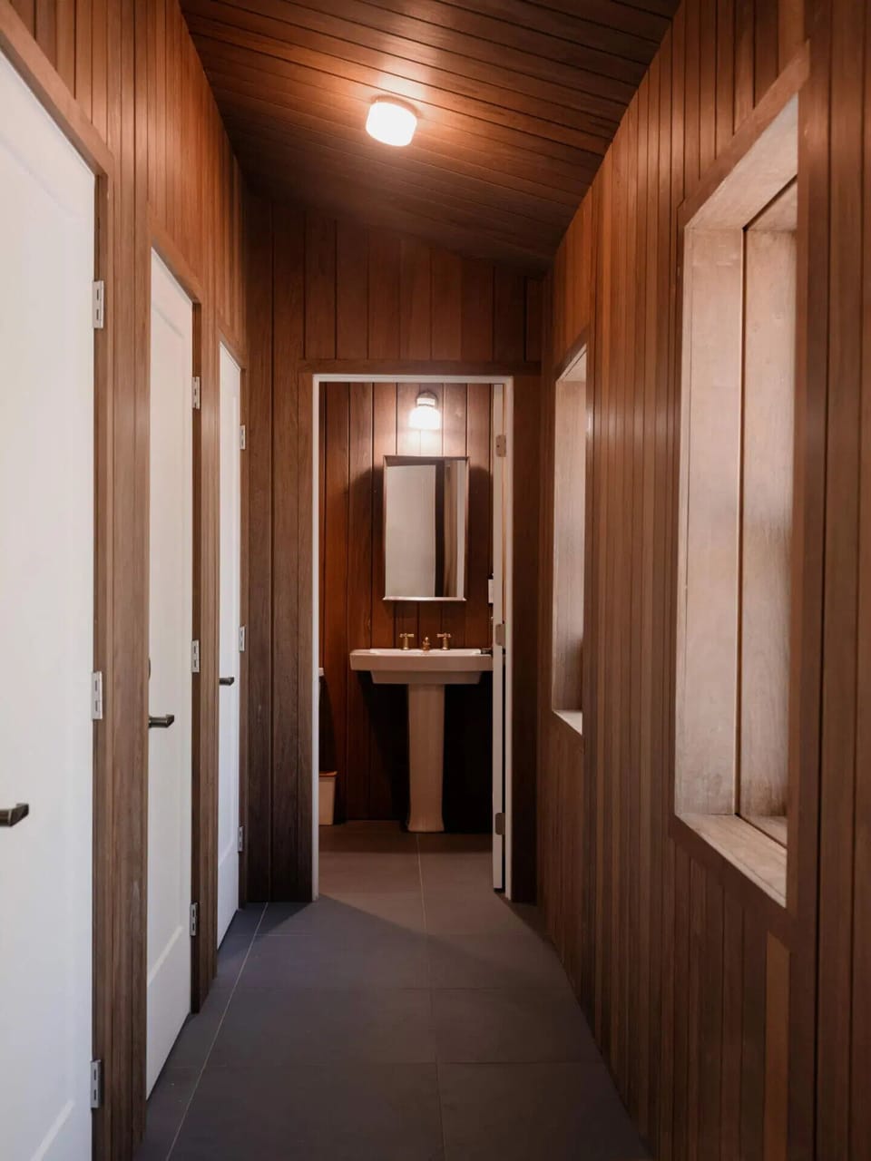 Walk warm wood-lined halls that feel calm and private.