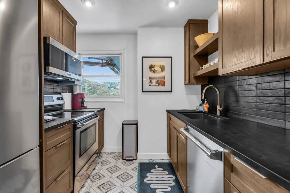 The kitchen which makes efficient use of its space with a full range of appliances and all the basic cookware needed to prepare a delicious meal.