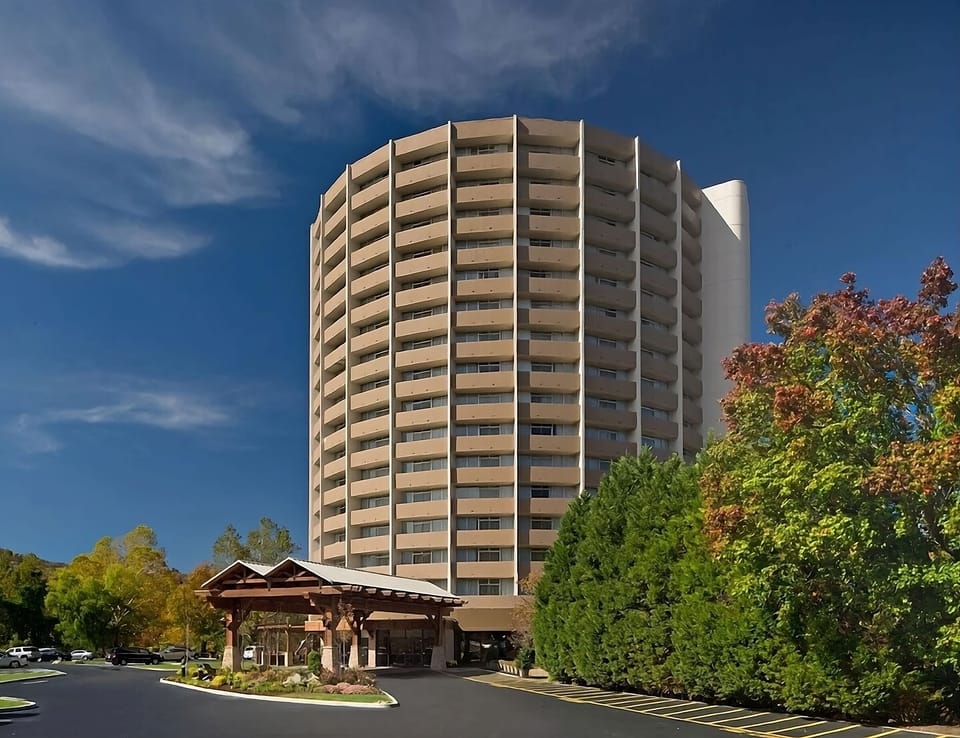 Picture your stay at this landmark tower near mountain scenery.