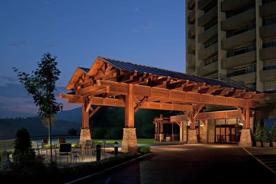 Enjoy a cozy evening arrival beneath warm lodge-style lighting.