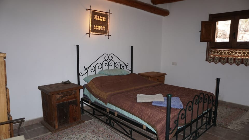 Downstairs bedroom with double bed in Almond Cortijo, Cortijos Rey Fini.