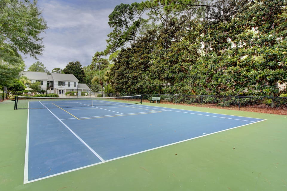 Tennis and Pickleball Court - Community court lined for tennis and pickleball, set near the Island Retreat pool area.