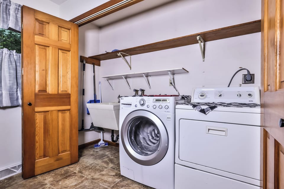 Spacious Laundry area equipped with a washer/ dryer