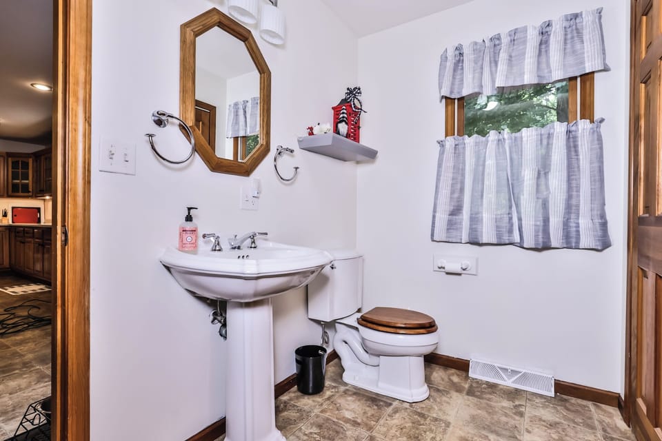 Bright 1/2 bath located right on the level