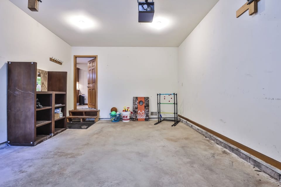 Huge 2 car garage w/ extra yard games