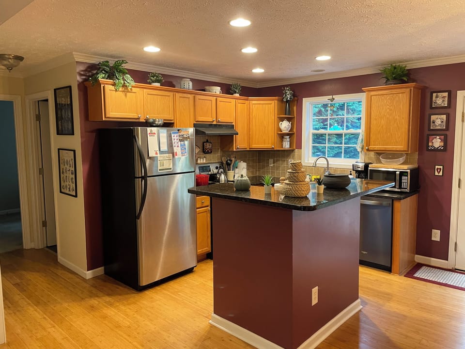 Fully stocked kitchen - pots, pans, plates, measuring cups, cutting board, etc.