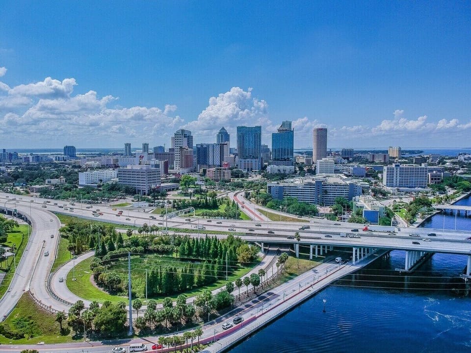 Explore the 2.6-mile Tampa Riverwalk, a scenic waterside path connecting Water Street to Armature Works—perfect for biking, walking, or scooting. Just an 8-minute drive away!
