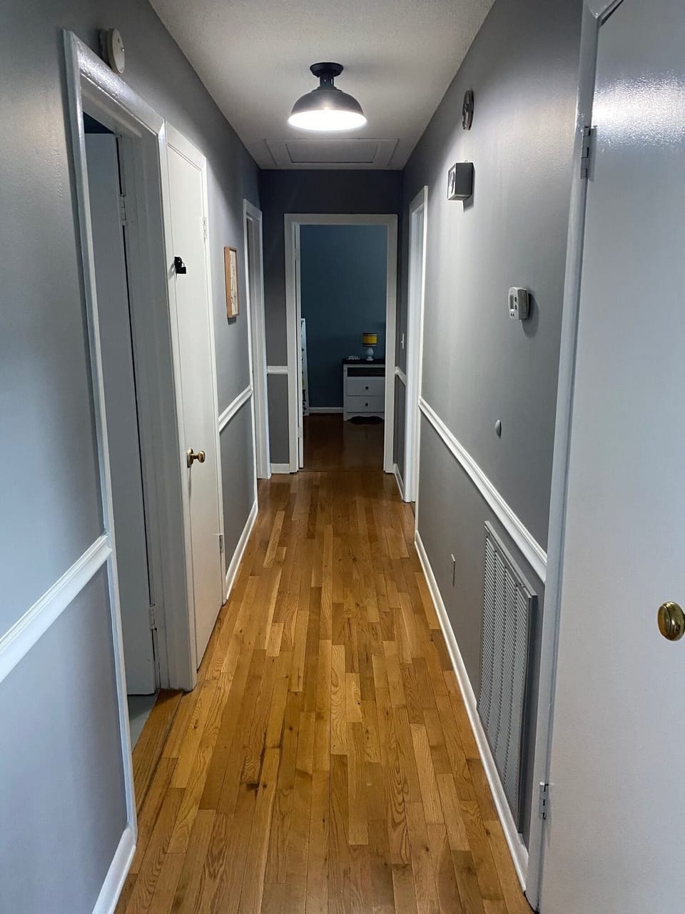 Hallway leading to three upper level bedrooms and hall bath