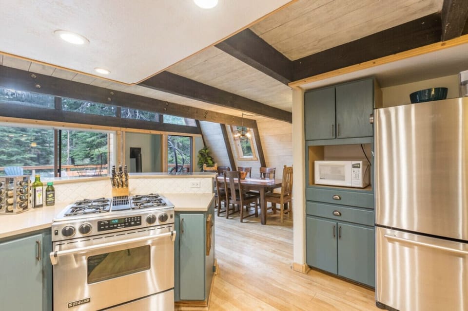 Recently remodeled modern kitchen!  Open concept dining area off kitchen along with gas fireplace!