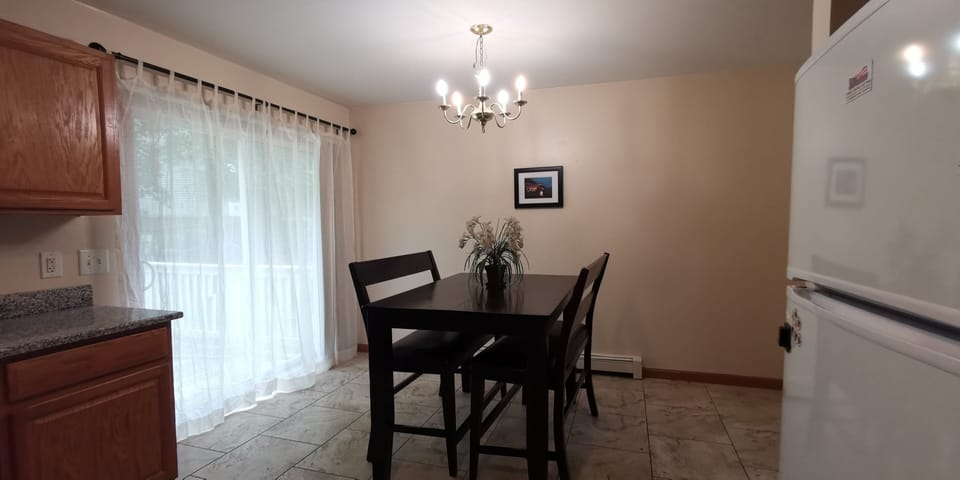 Dinning area adjoint to a small deck and back yard.