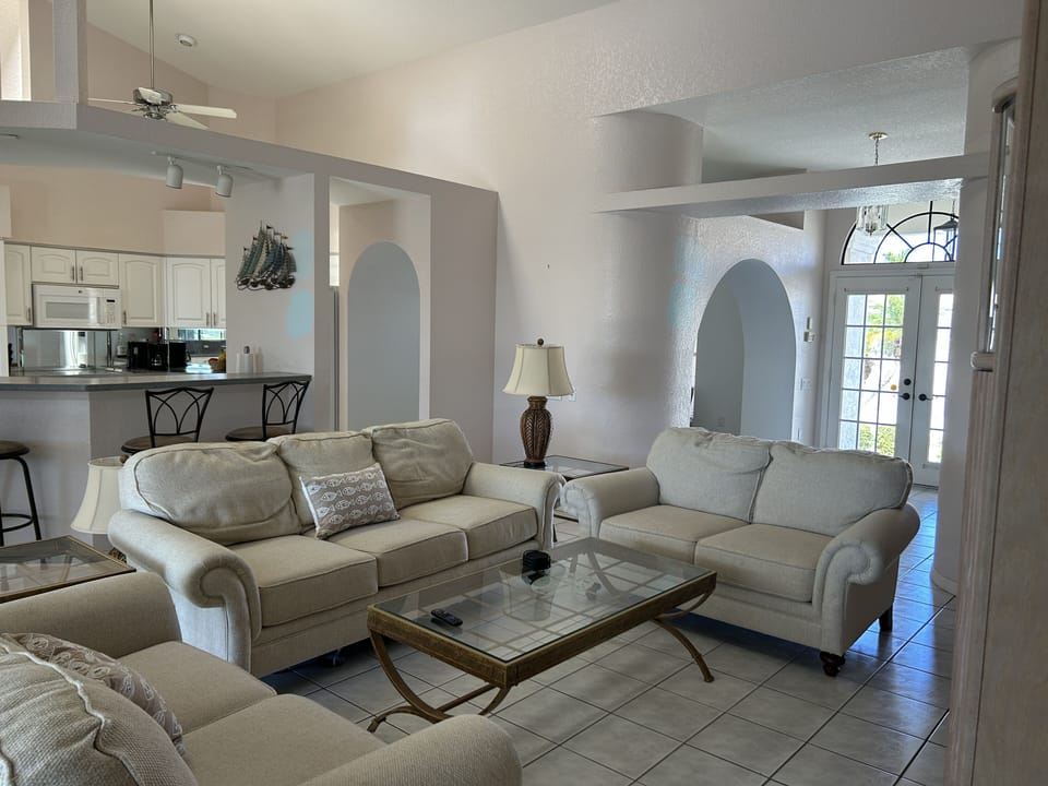 Family room with vaulted ceilings is centrally located