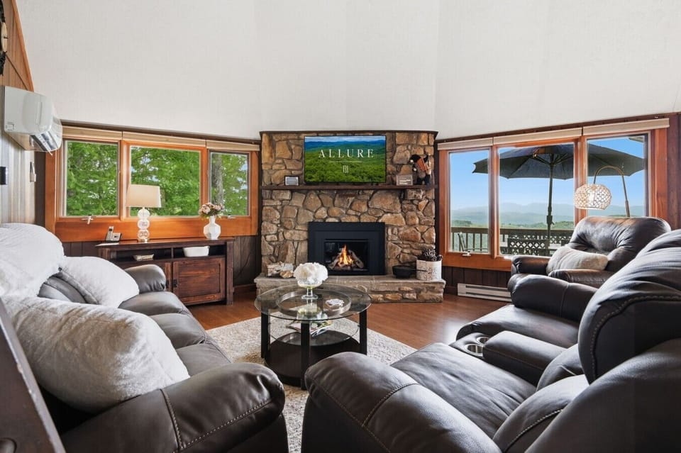 Living room with smart TV, fireplace and views