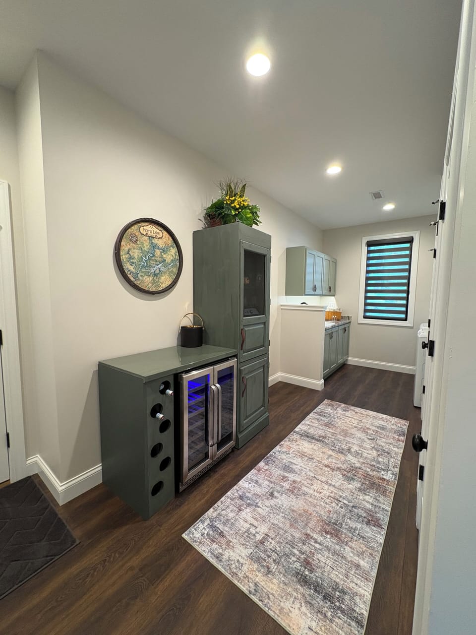 Main lvl beverage bar area off kitchen w dual zone frig well stocked glassware