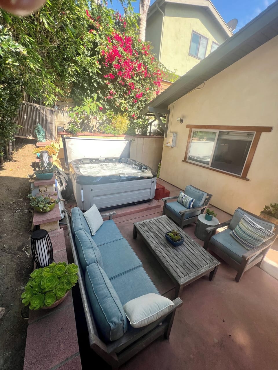 Jacuzzi (2021) and secluded tree lined outdoor area.