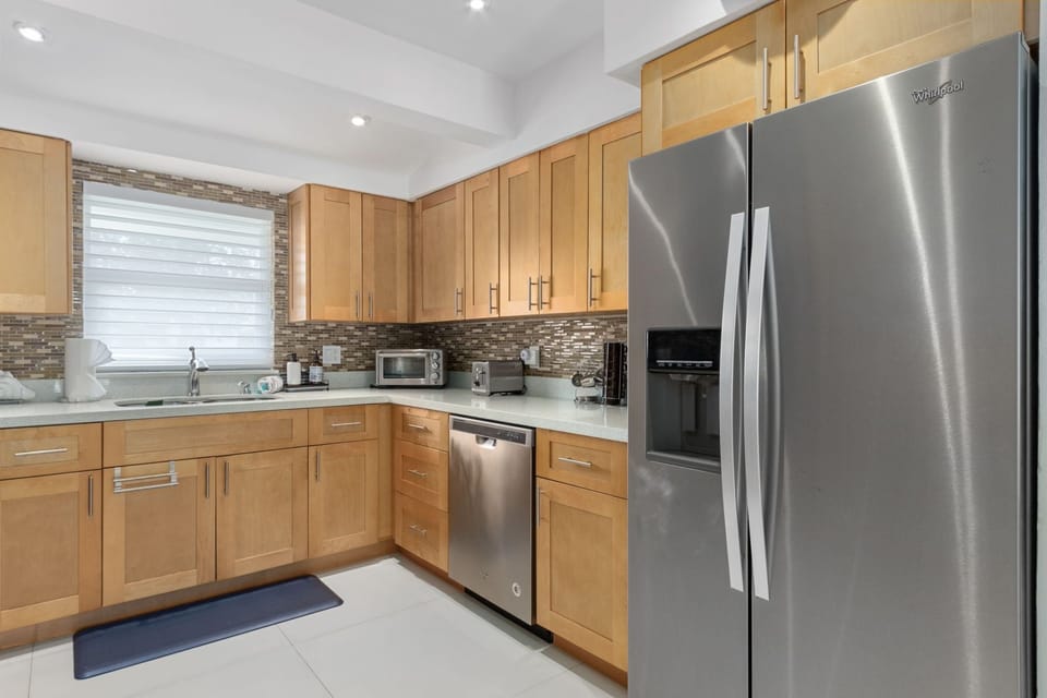 The kitchen features all stainless steel appliances.