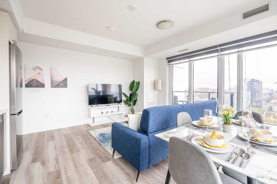 Living Space Highlighting Sleek Decor And Access To The Private Balcony