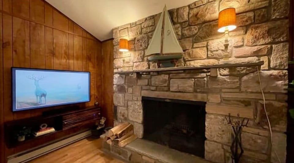Smart 55" Samsung TV, with stone wood fireplace perfect for cozy movie nights