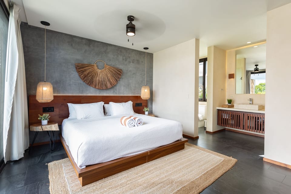 beautifully designed bedroom with king size bed and full bathroom