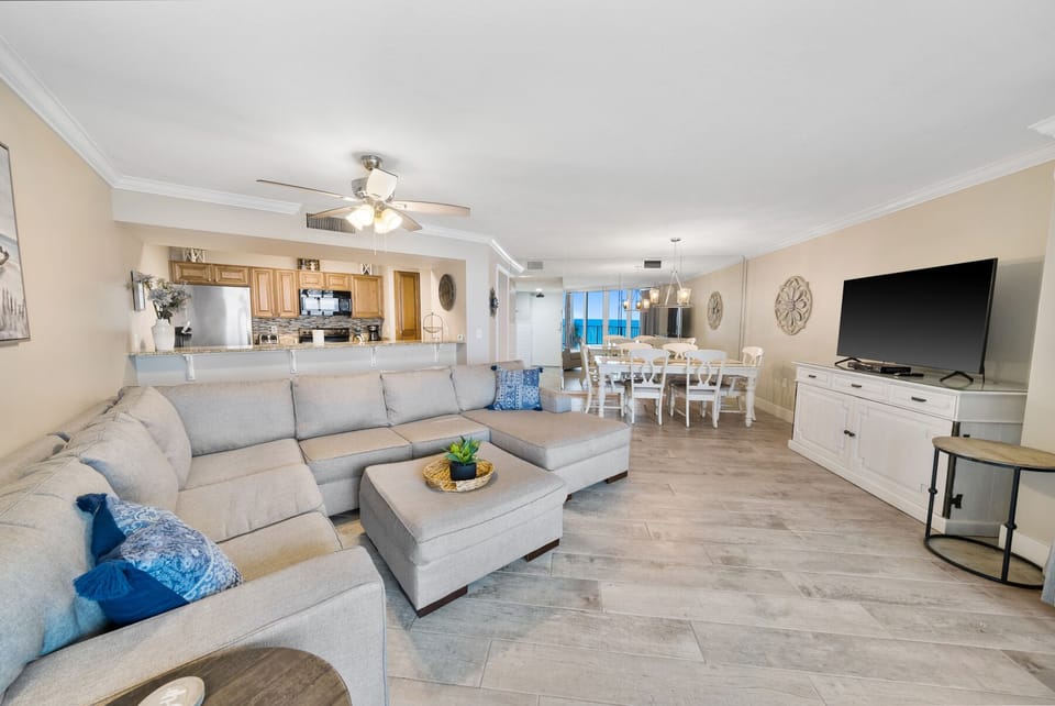 Sink into the plush sectional sofa and enjoy your spacious open-concept retreat with modern kitchen and ocean views.