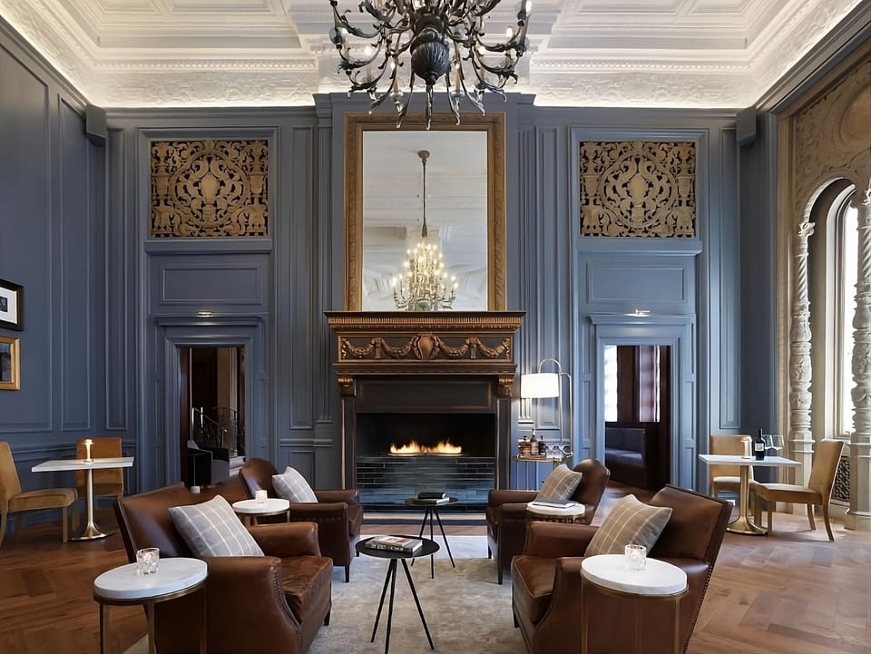 Settle by the glowing fireplace for a cozy evening drink.