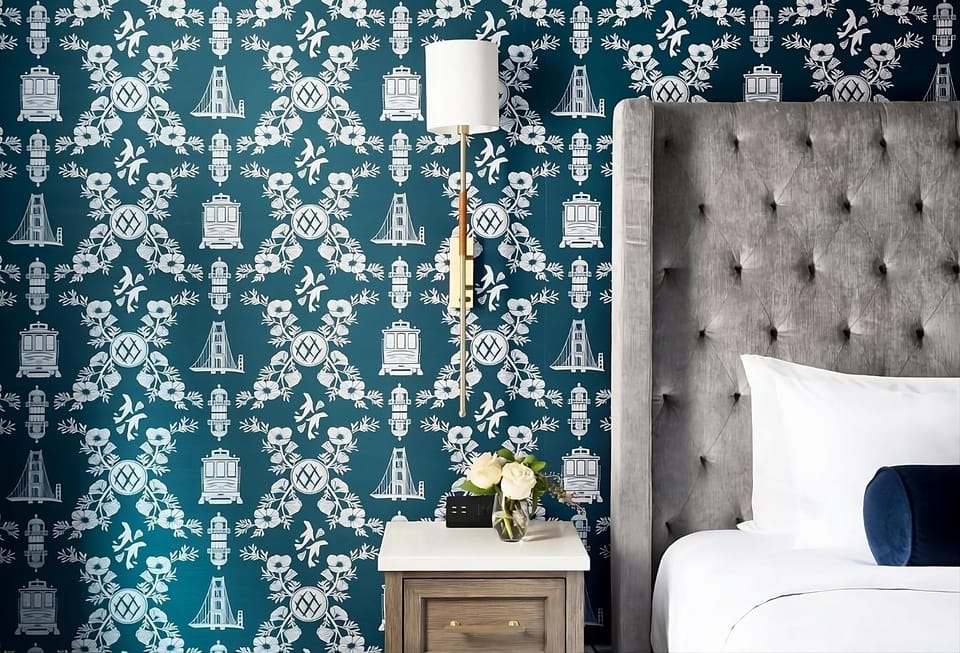 Sink into a velvet headboard backdrop with cozy bedside lighting.