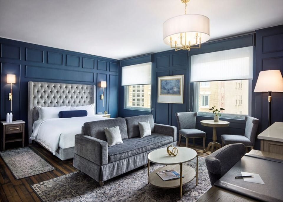 Spread out with a sofa lounge area right beside the bed.