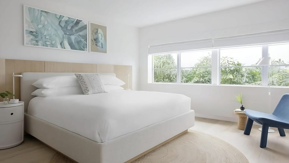 Unwind into crisp linens and airy, resort-like calm.