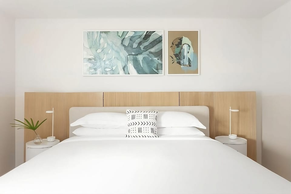 Recharge in a minimalist king room designed for deep rest.