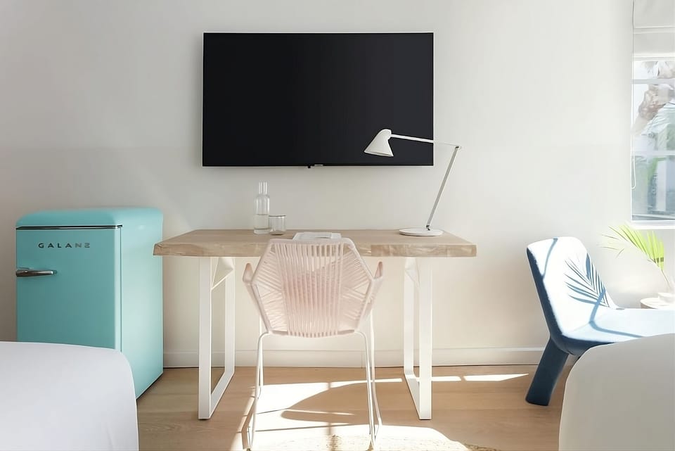 Unwind with your favorite shows from the cozy in-room setup.