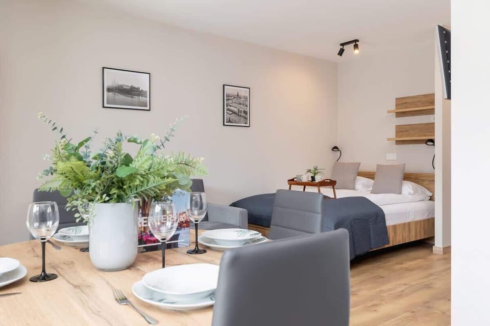 Another view of the bedroom, showcasing its simple design, wooden flooring, and relaxing ambiance.

