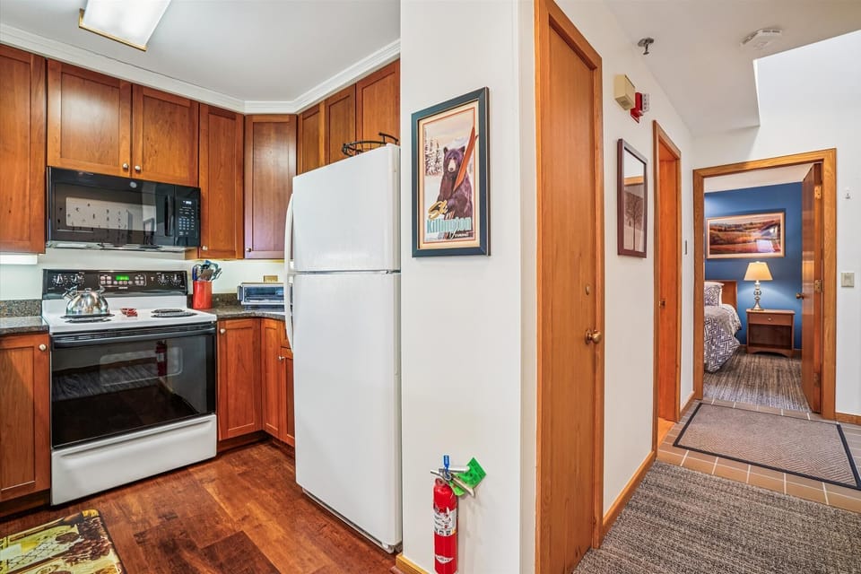 Full kitchen with all essentials, located just steps from the bedroom and main living space.