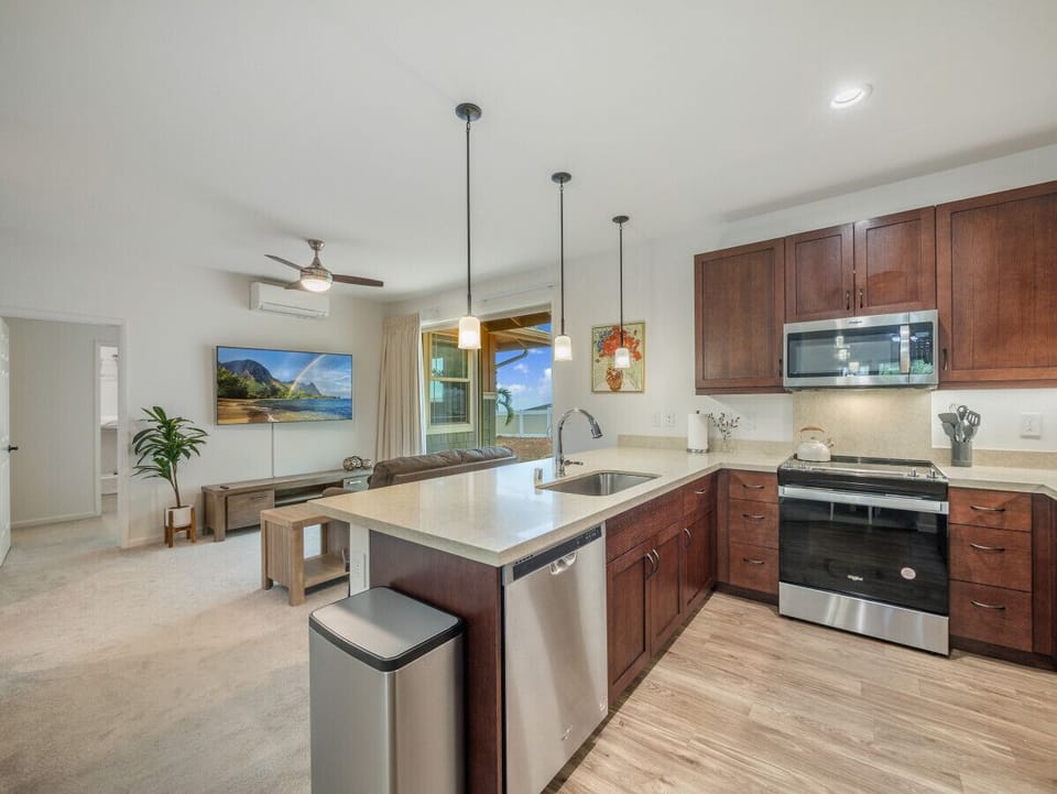 Fully equipped kitchen with all appliances, dinnerware, silverware, kitchen utensils, and cooking pans/pots.