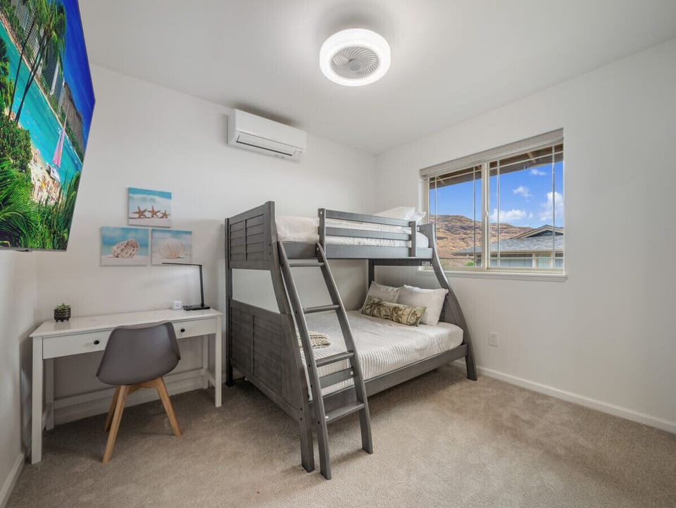 Mountain view from 2nd floor bedroom #4 with bunk bed with full size and twin size beds, memory foam pillows, AC, ceiling fan, and TV.