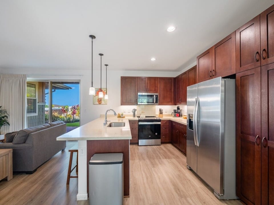 Fully equipped kitchen with all appliances, dinnerware, silverware, kitchen utensils, and cooking pans/pots.
