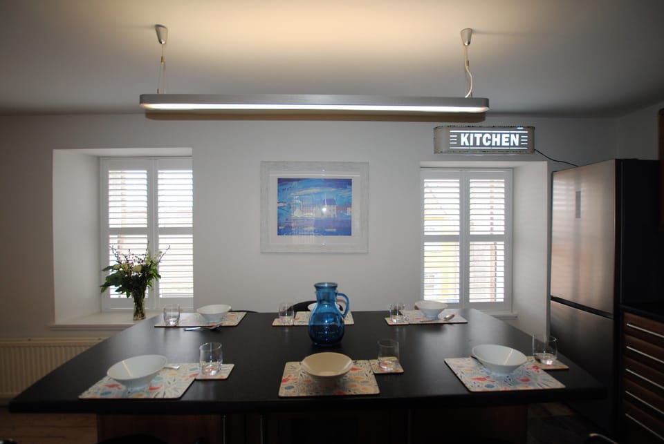 The dining area is a cosy space to gather and enjoy a meal