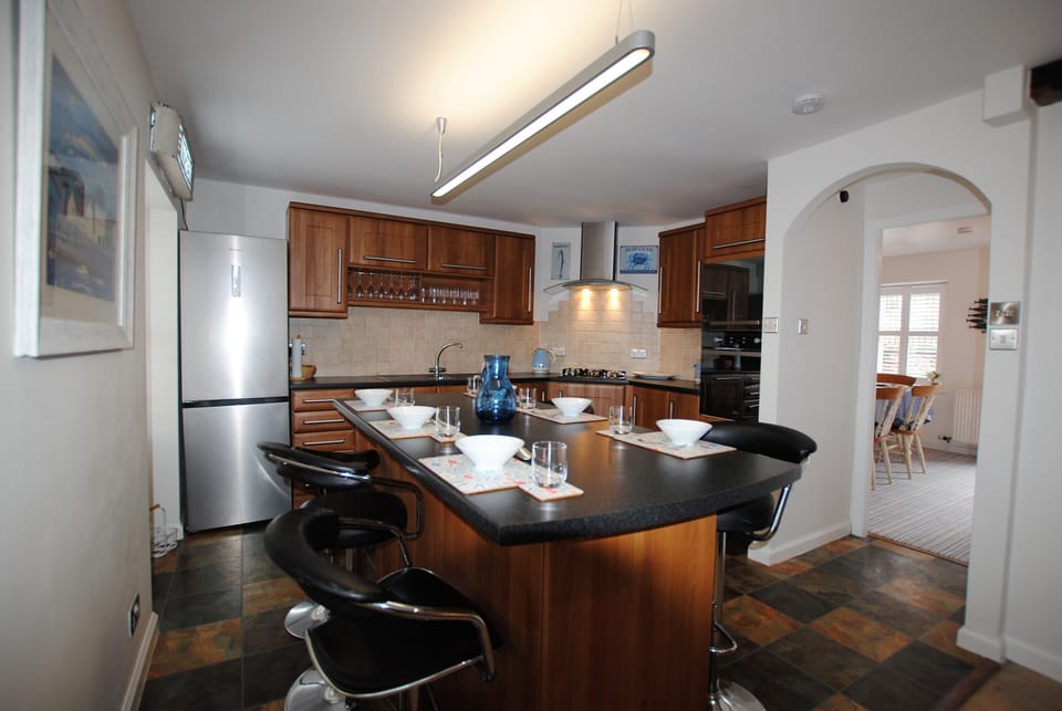 The kitchen island doubles as a second dining space