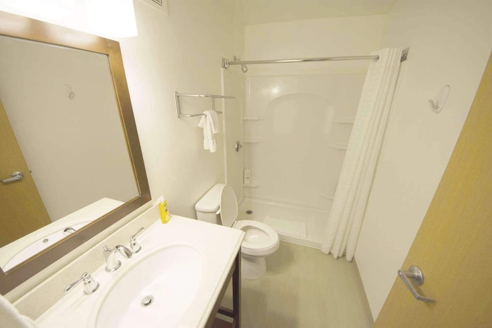 Bathroom with walk-in shower, sink and mirror