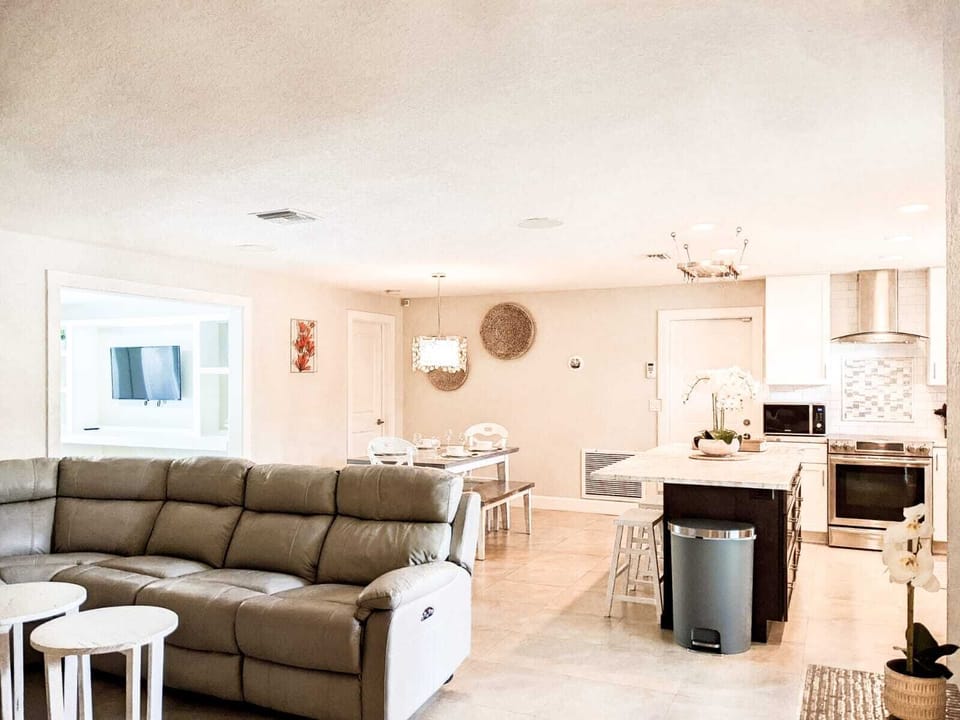 Open concept living room, dining area and kitchen.