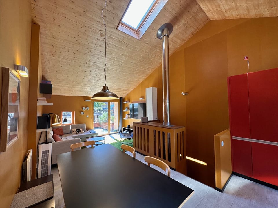 Large living room with dining table and view of the lounge
