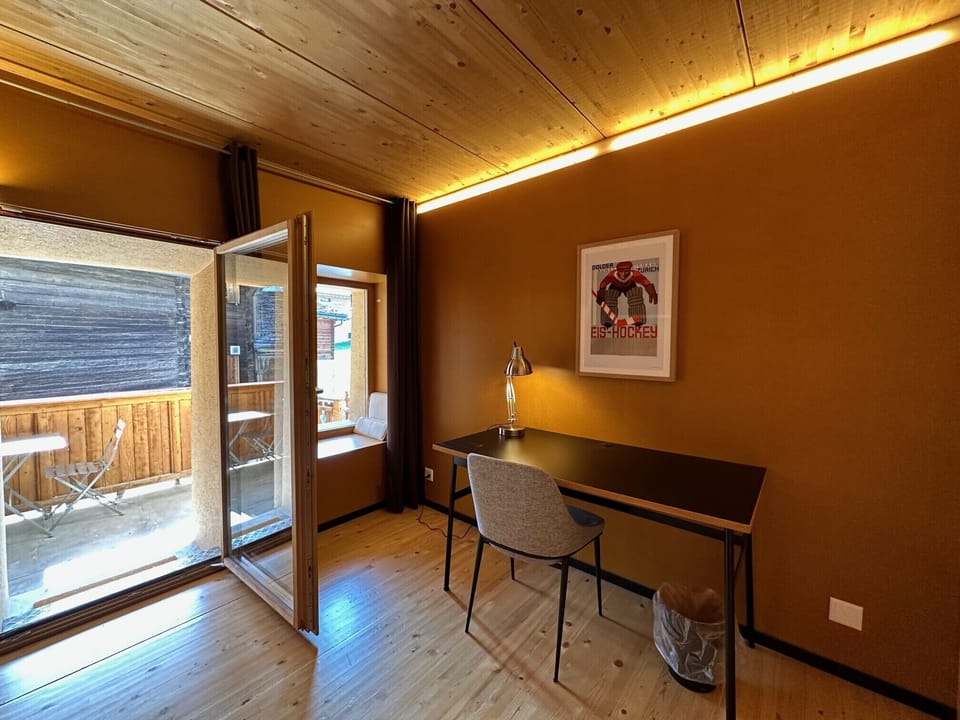 Practical office area with access to the balcony