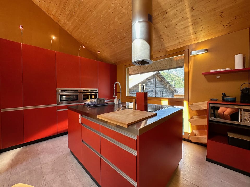 Modern kitchen with light-filled window and large worktop