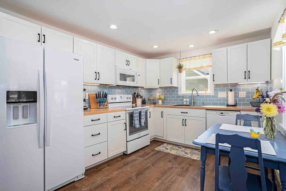 An abundance of natural light fill this fully equipped farmhouse kitchen.