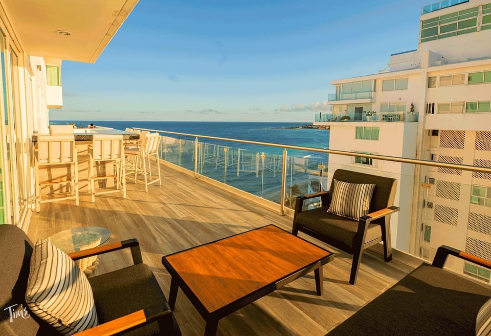 Penthouse 2 of 5: The Expansive Private Terrace Features a Brand New Sofa Set, Bar Stools, &amp; 2 Sun Loungers, purchased in 2024  Looking this Direction you have the Ocean View.