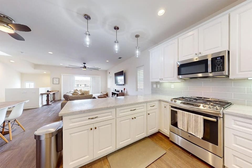 Bright, open kitchen with modern appliances and spacious island