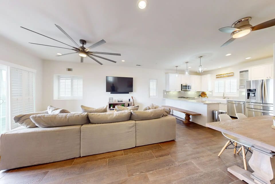Open concept living room & kitchen with comfy sectional – Pismo Beach ocean view