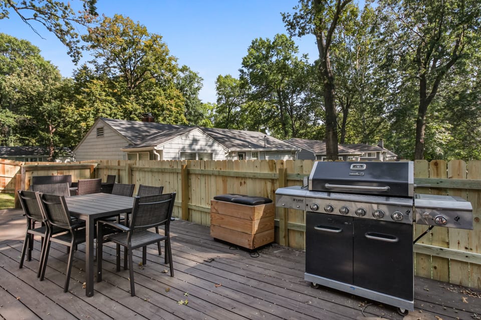 Back patio with outdoor seating and propane grill