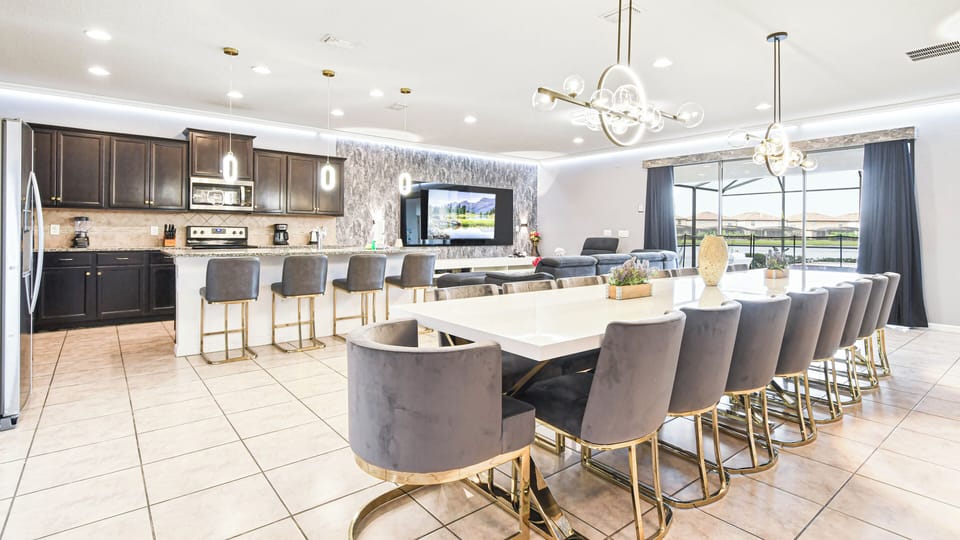 Modern kitchen and dining combo with elegant seating and open layout!