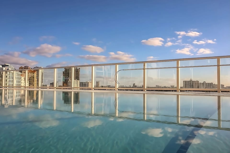 Float peacefully while city reflections shimmer across the water.